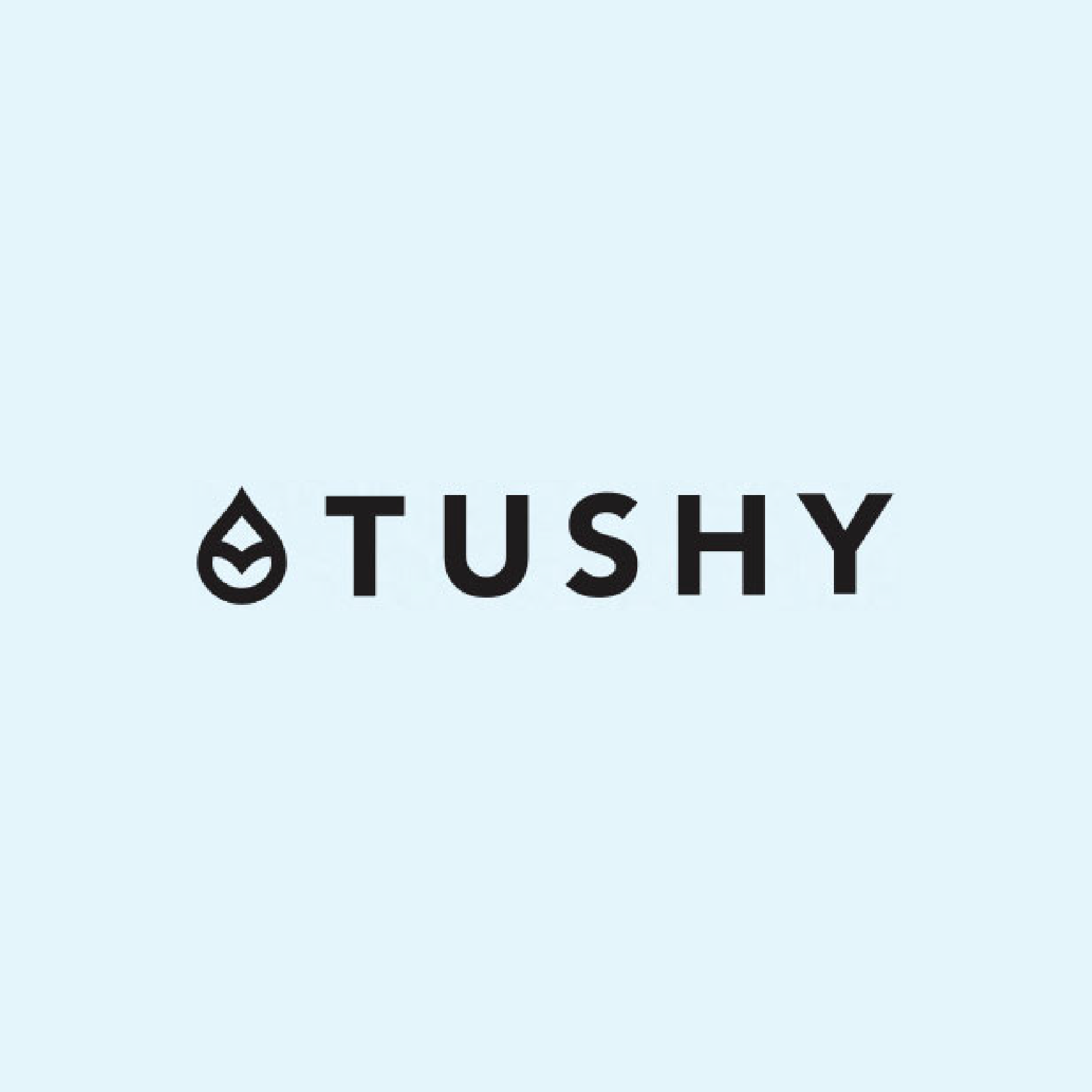 TUSHY logo with a drop on the left and a light blue background