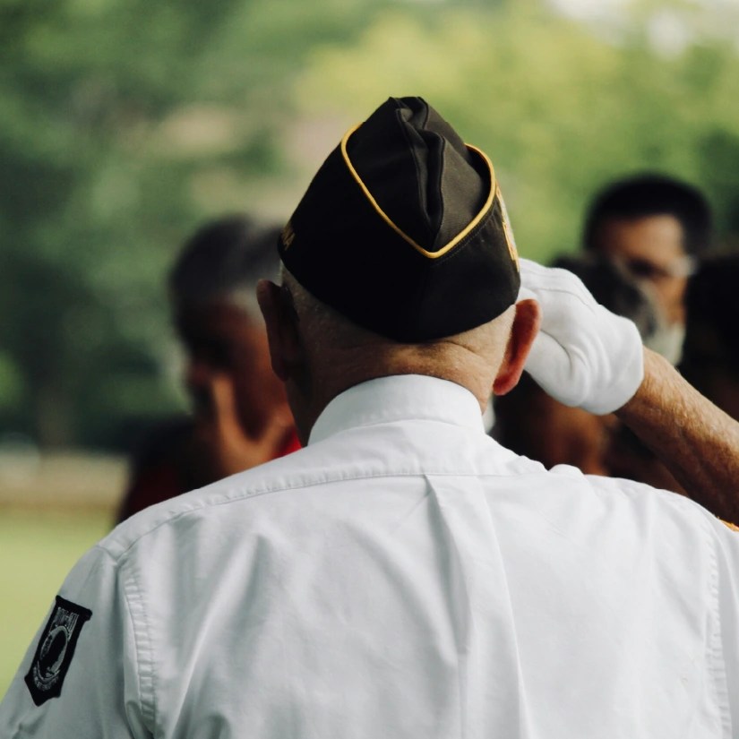 Army veteran saluting a crowd