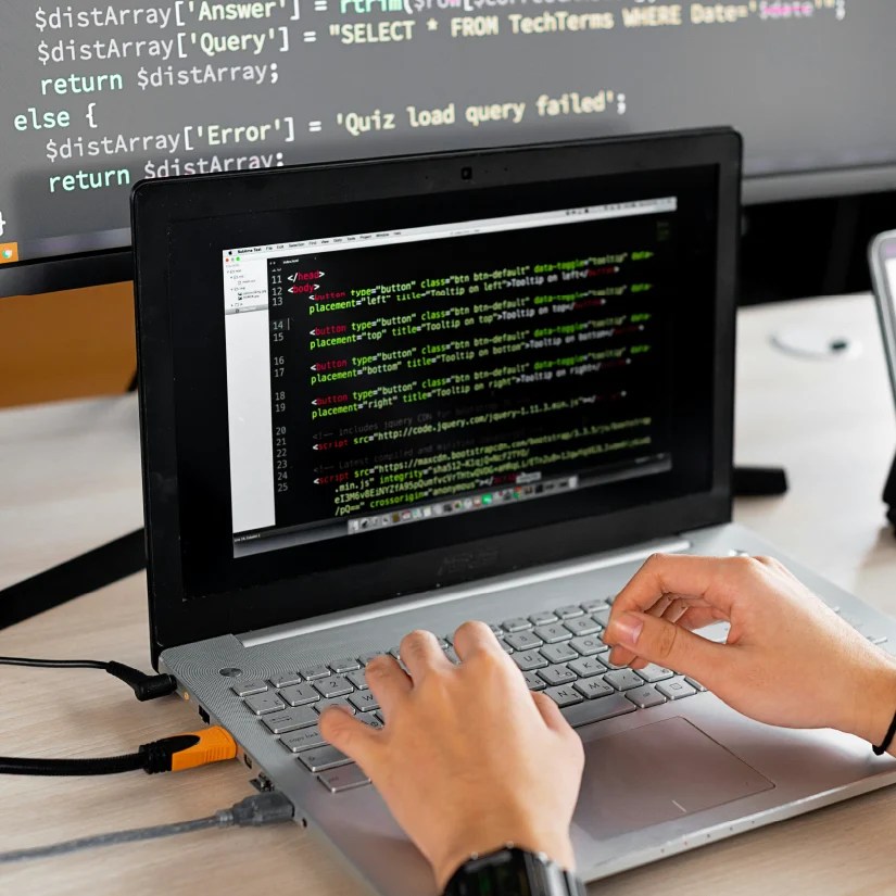 Developer typing on a computer