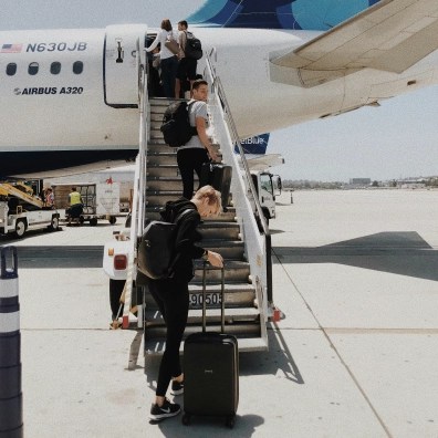 People boarding a plane on a tarmac