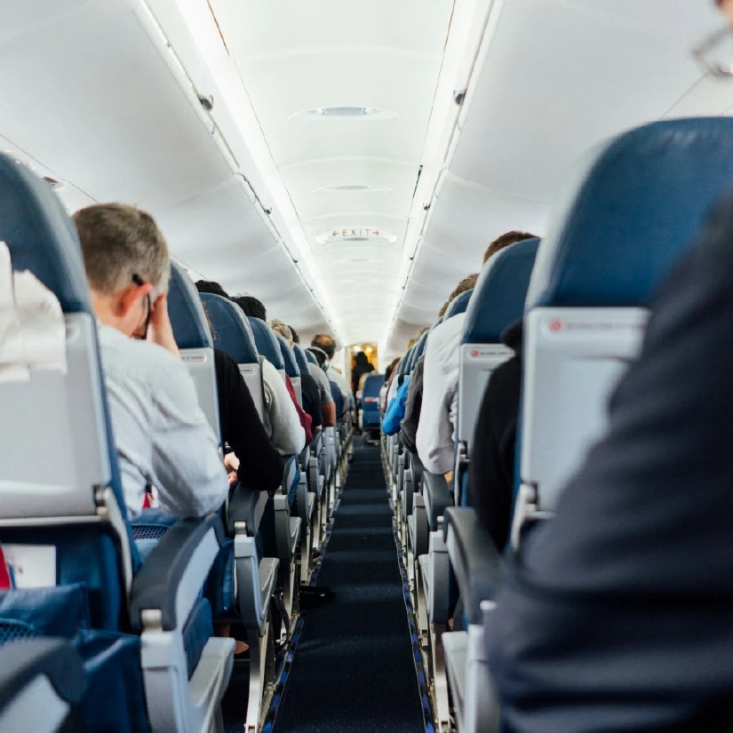 Passengers sitting in seats on an airplane