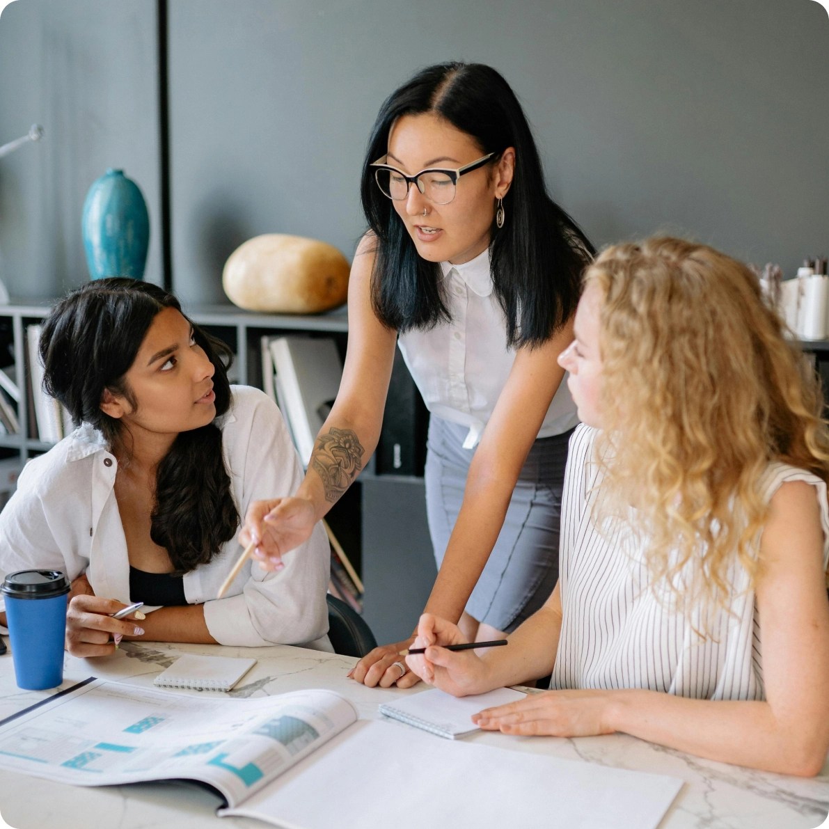 Three women working on a project