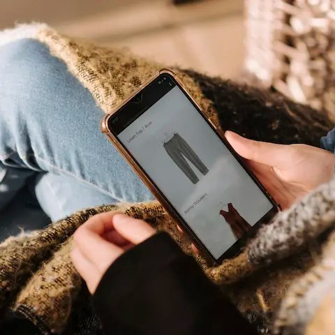 Person shopping online on their phone.