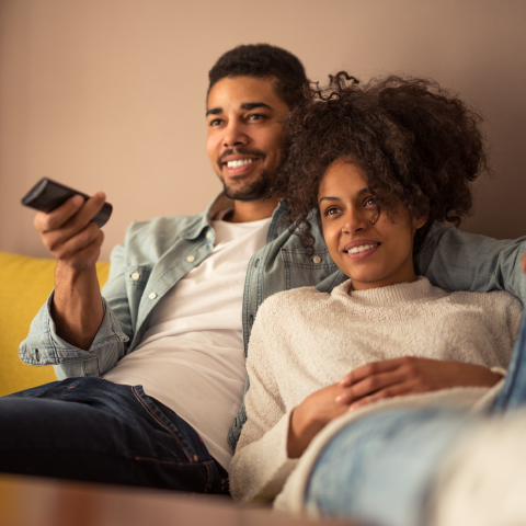 Couple watching TV on a couch